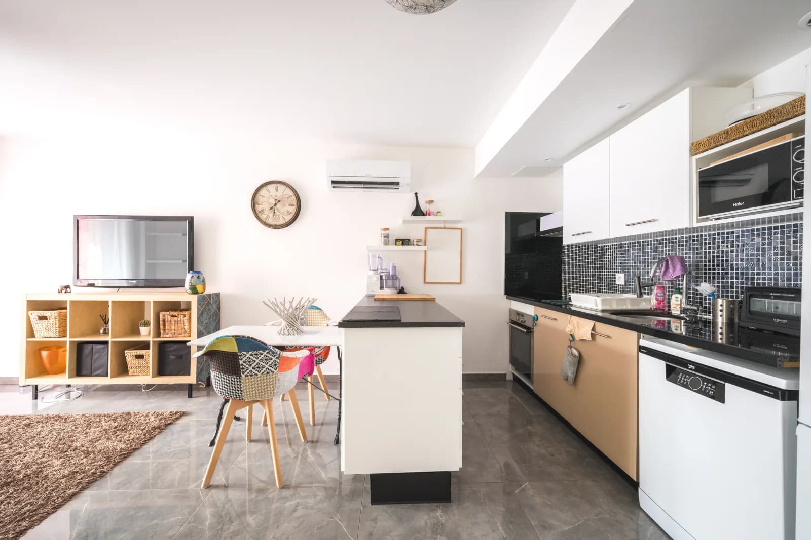 Living room with open-plan kitchen and central island