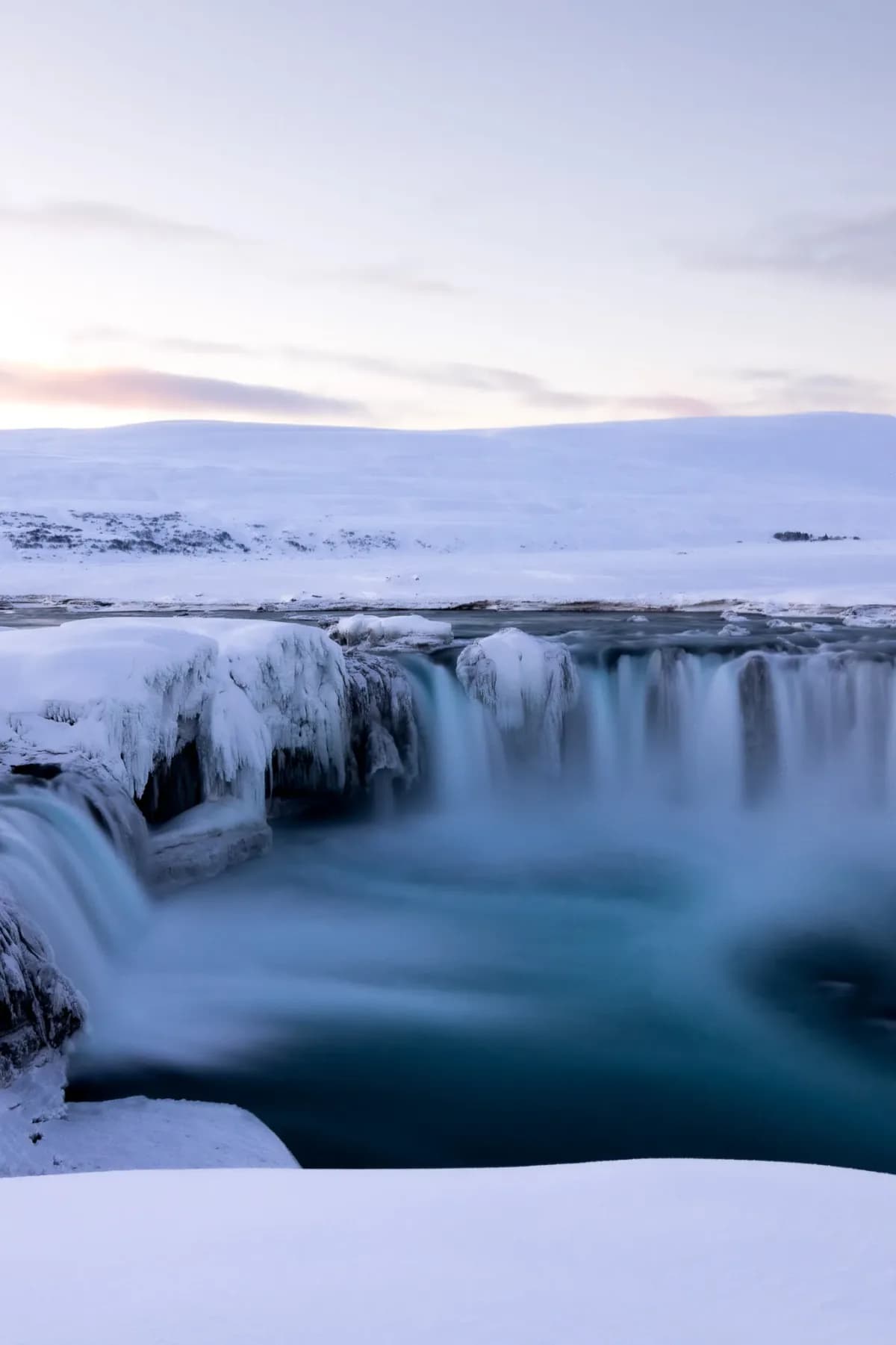 Frozen waterfall in the snow