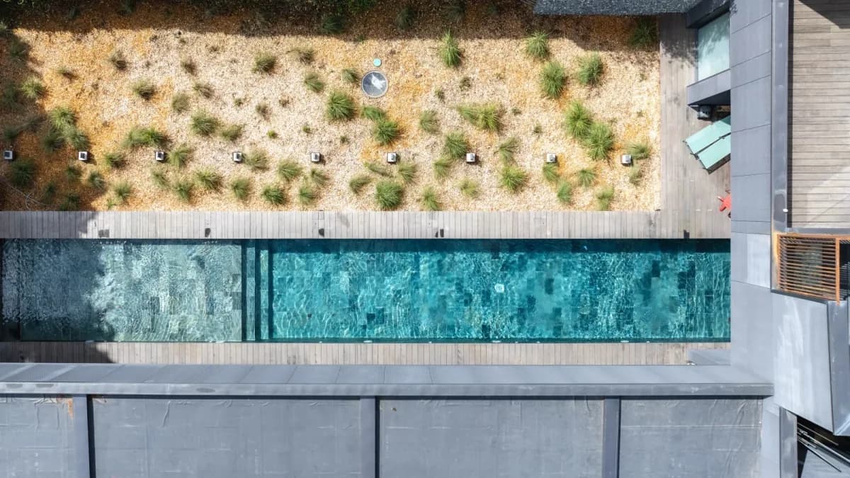 Overhead shot of a lap pool and dry garden