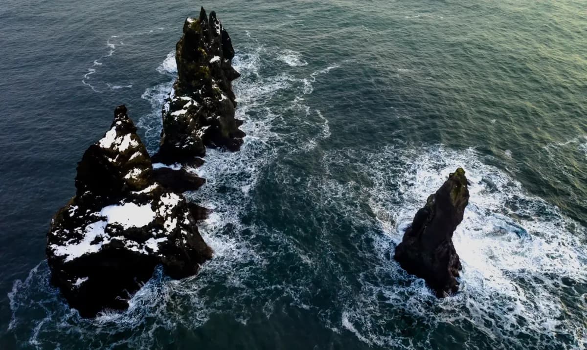 Aerial view of rock stacks in the sea