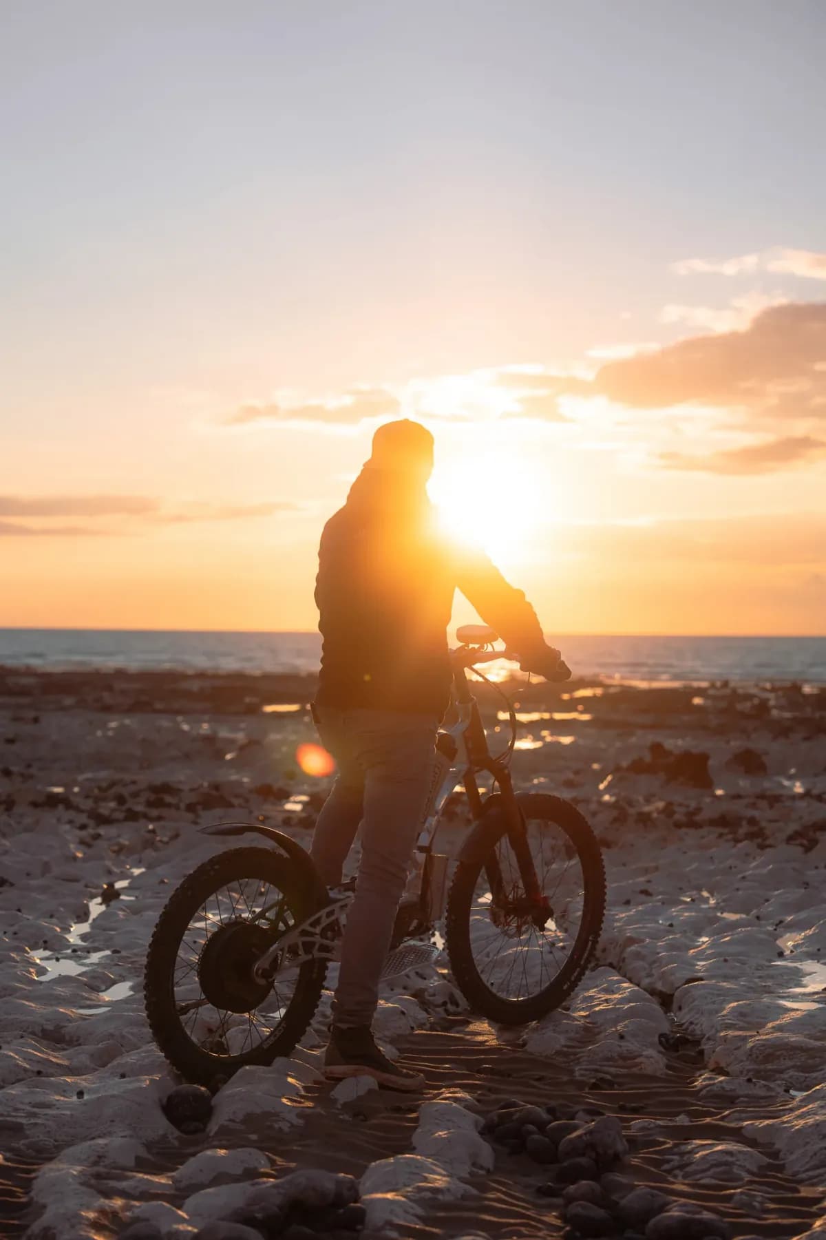 Cyclist silhouetted against the sunset