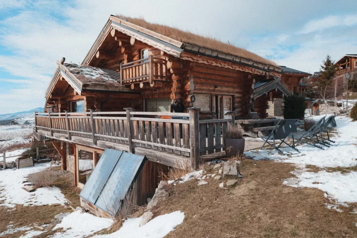 Wooden chalet under snow