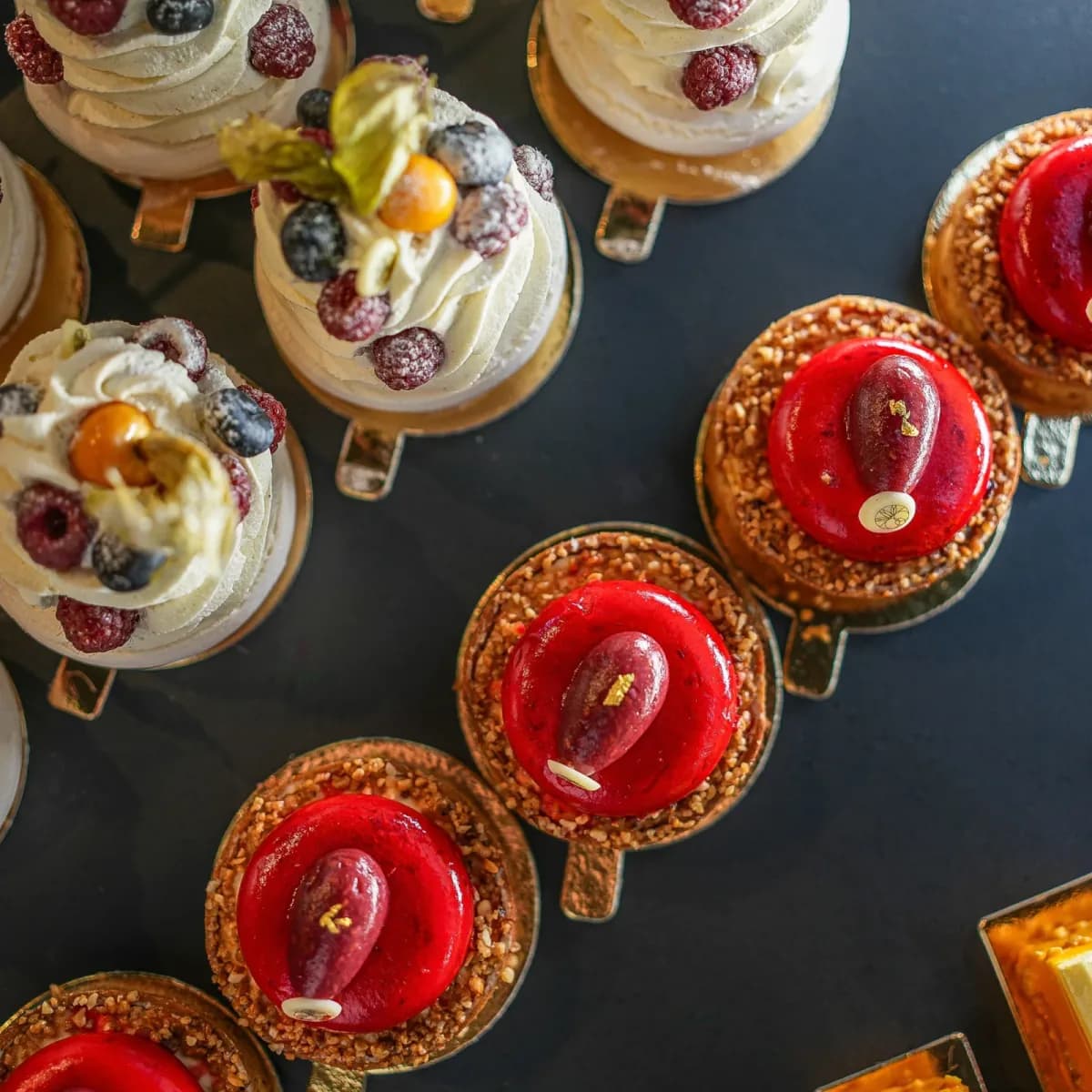 Red tartlets and pavlovas seen from above
