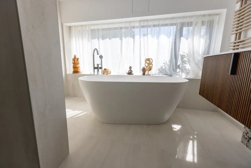 A freestanding bath in a bright bathroom